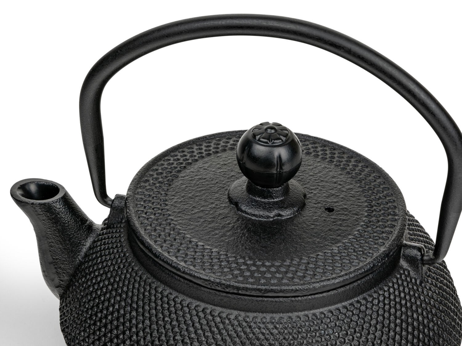 Black cast iron teapot with textured surface