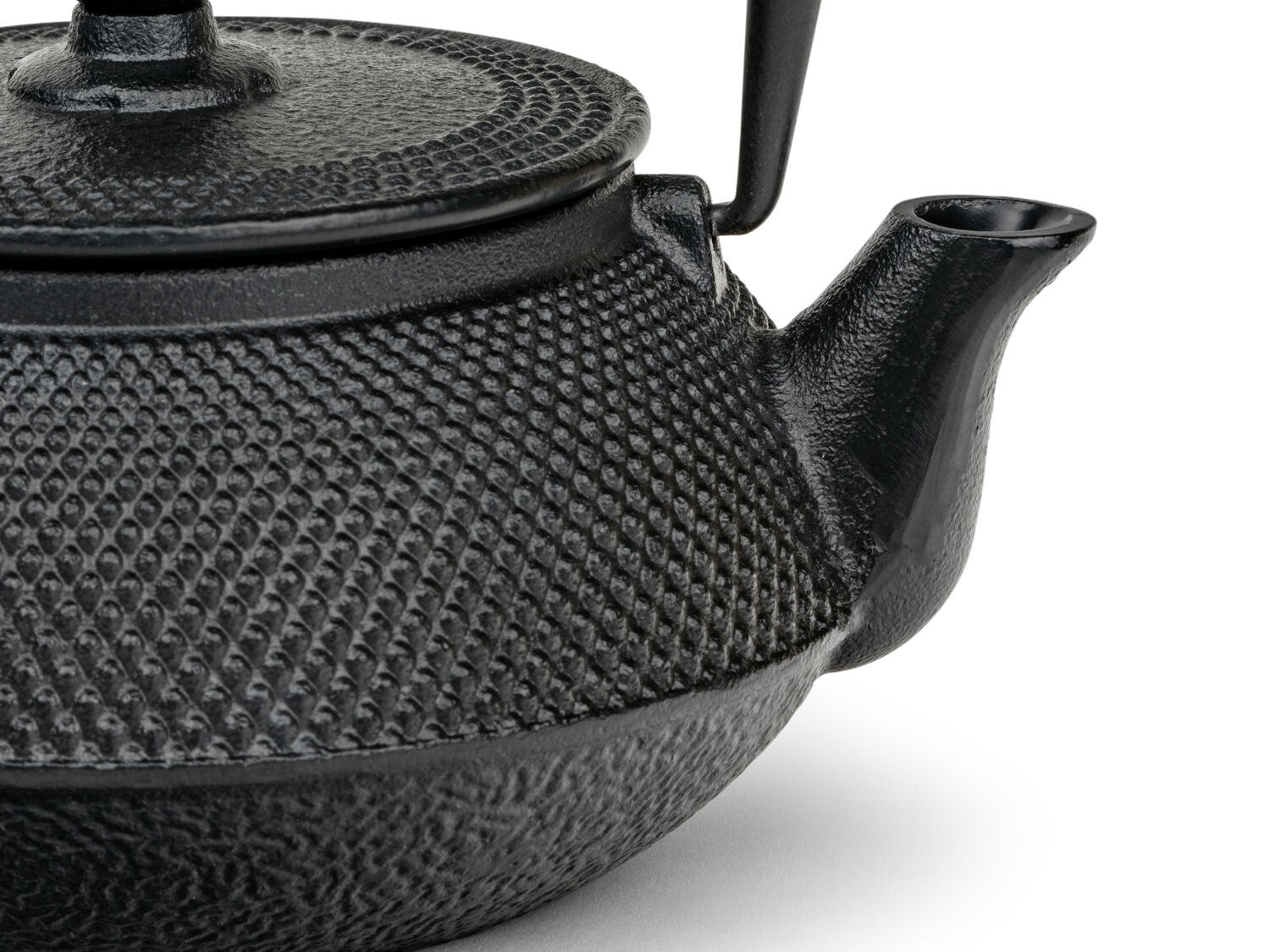 Black cast iron teapot with hammered pattern