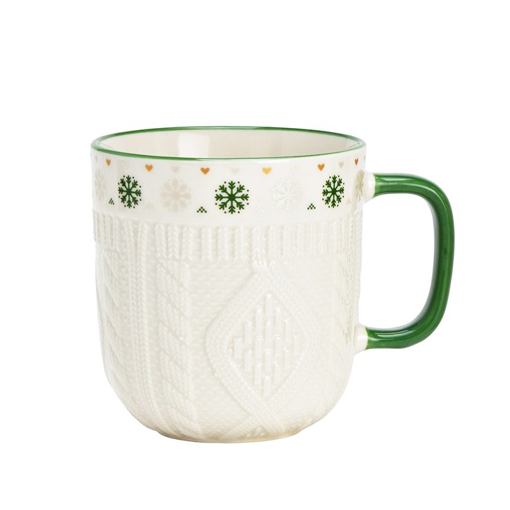 Mug with winter pattern and green handle