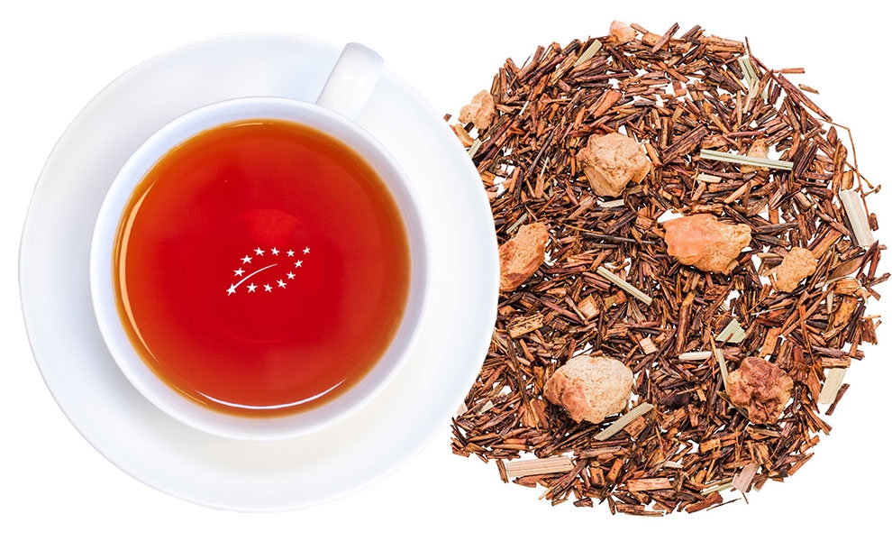 Weiße Tasse Rooibostee neben losem Rooibostee, Tee, Schwarztee, Rooibos, Blätter, Tasseninhalt?