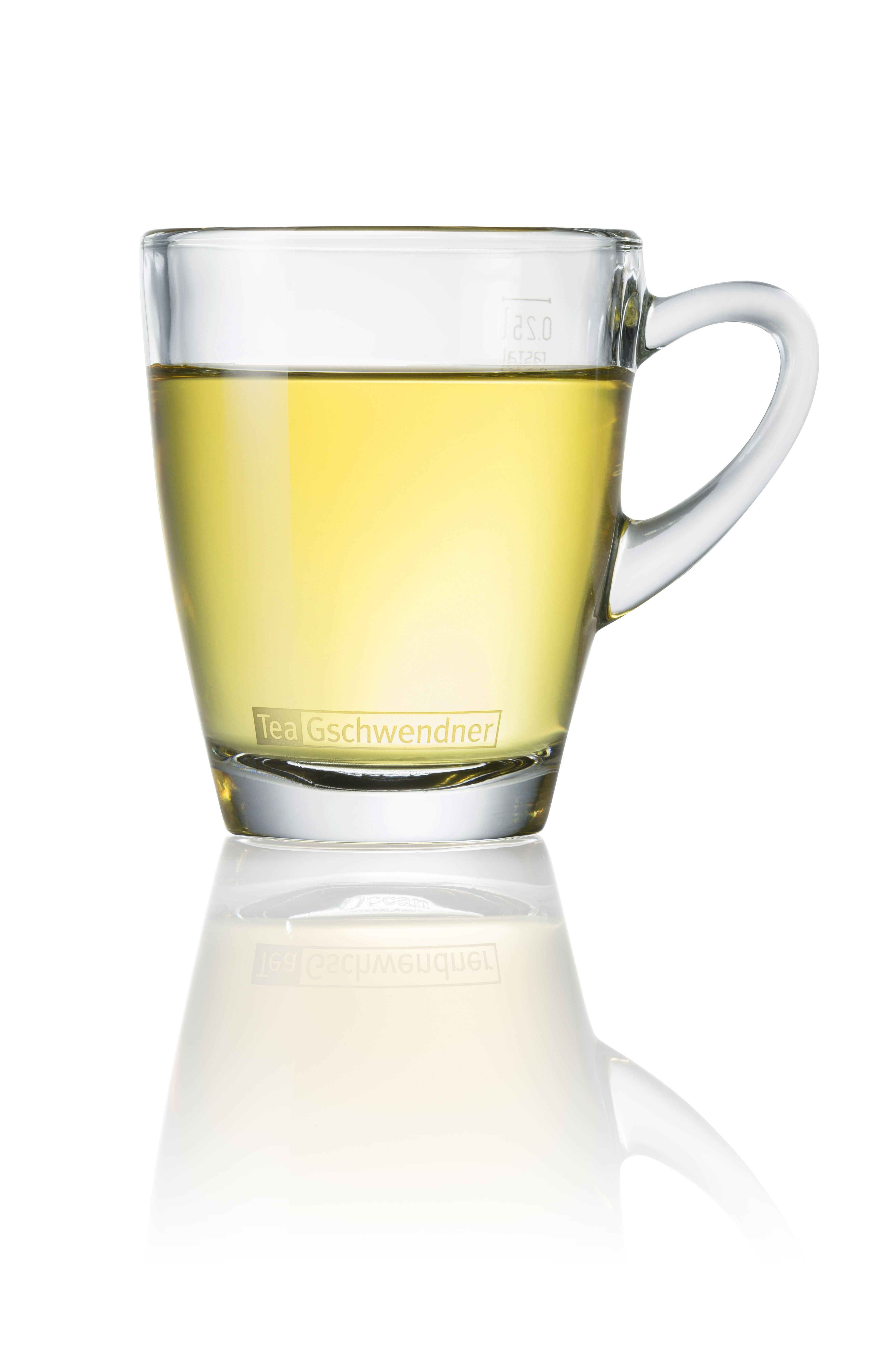 Light cup of organic ginger tea in a glass cup, loose organic ginger with a pleasantly sweet taste and mild spiciness