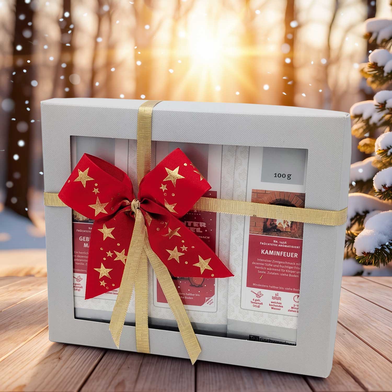 Geschenkbox Kaminfeuer mit gold-roter Schleife, Geschenkbox, Tee-Set, Geschenkverpackung, roter Schleife, 100 g, Tee-Geschenkset, Früchtetee, Kaminfeuer-Aroma, Geschenkbox, Weihnachtsschleife