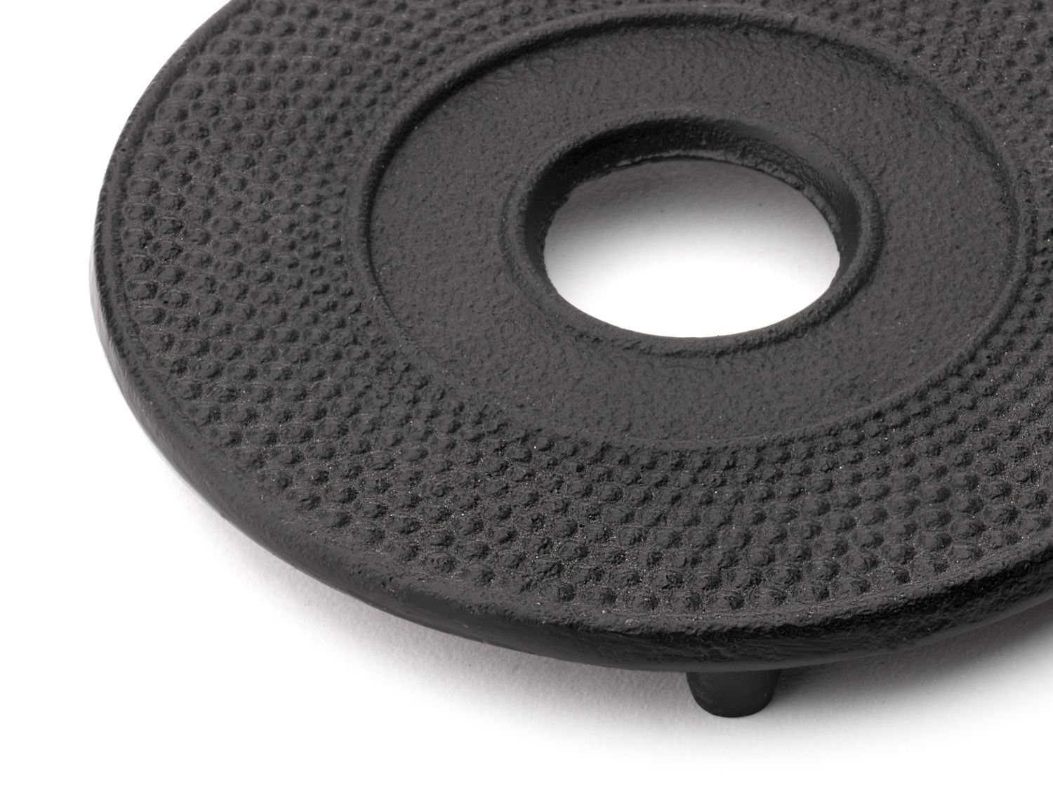 Black cast iron teapot trivet with knobs