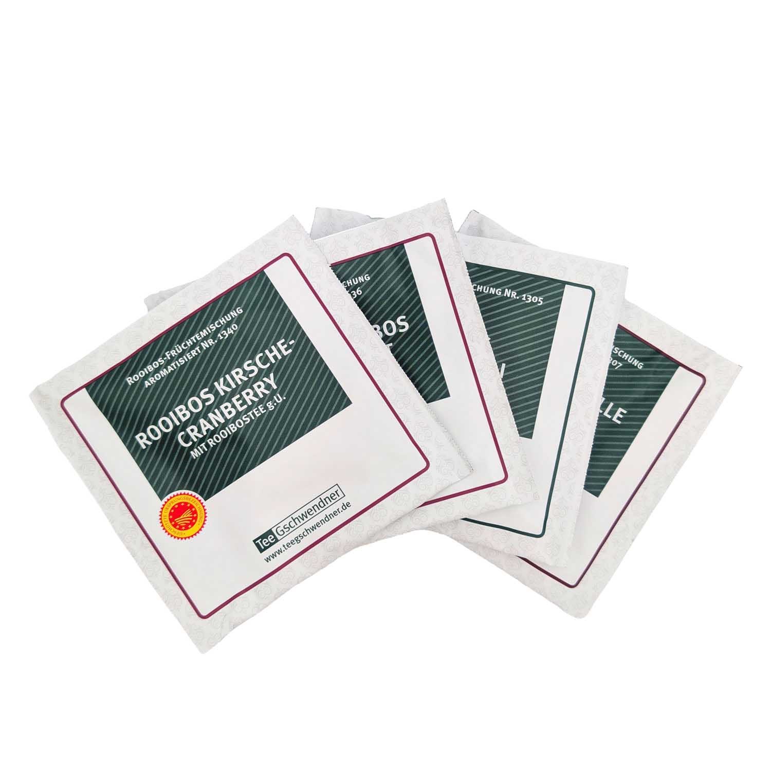 Vier einzeln verpackte Teebeutel Rooibos Kirsche Cranberry, aromatisierte Rooibos-Früchtemischung