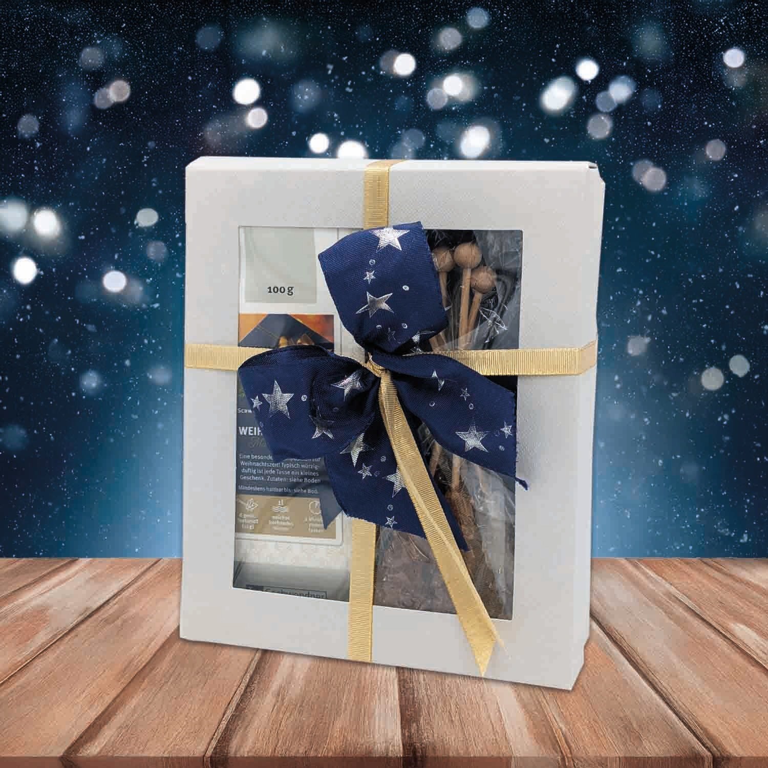 Geschenkbox mit blau-goldener Schleife auf Holztisch, Geschenkverpackung, Geschenkbox, Bandgold, Schleife, Starry-Design