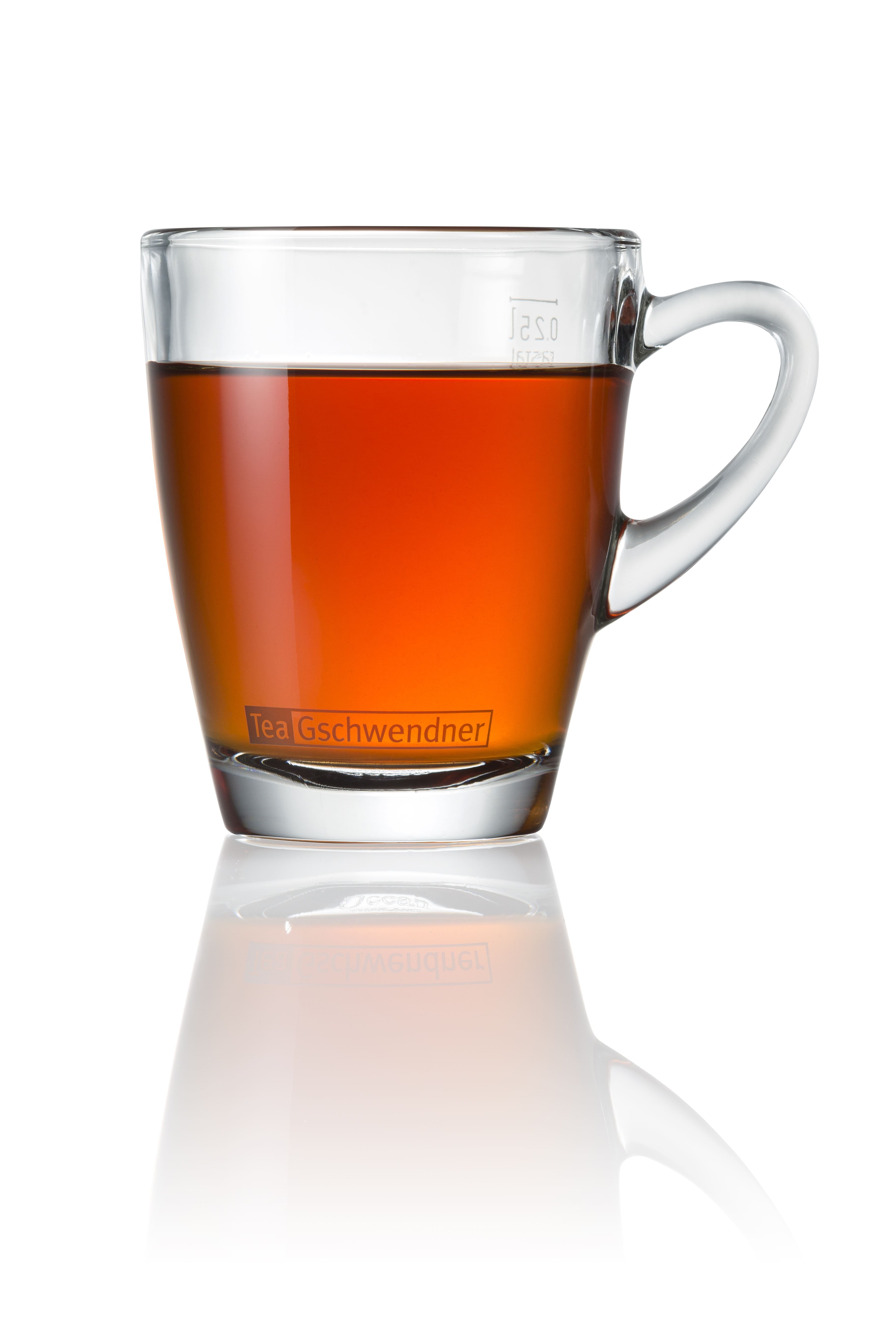 Glass cup filled with black tea