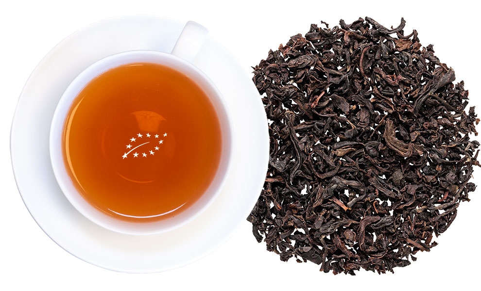 Weiße Tasse mit Schwarzem Tee und losem Schwarztee, Tee, Schwarztee, Loseblätter, Kanne, Kupferfarbig