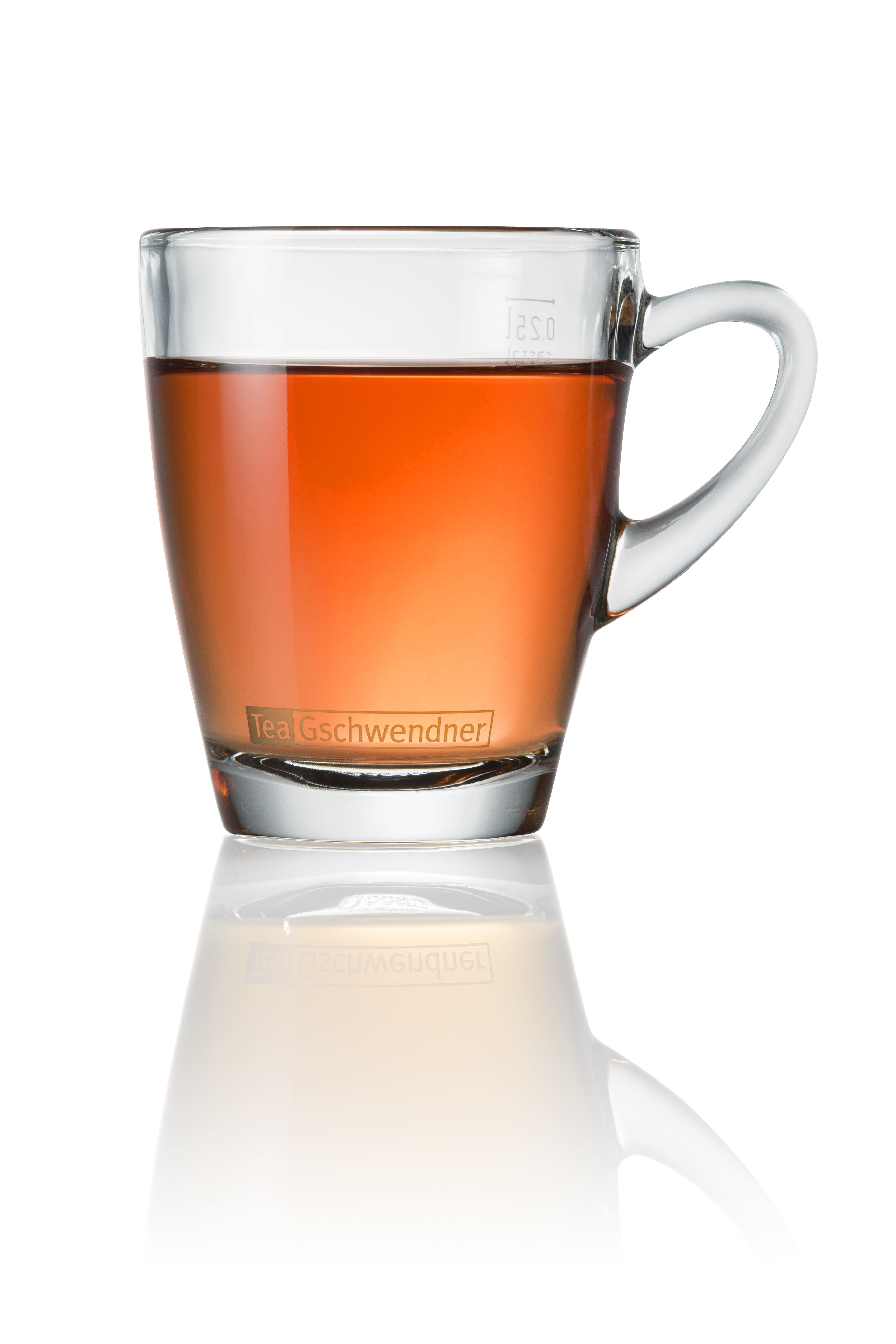 Transparent glass cup filled with brewed tea