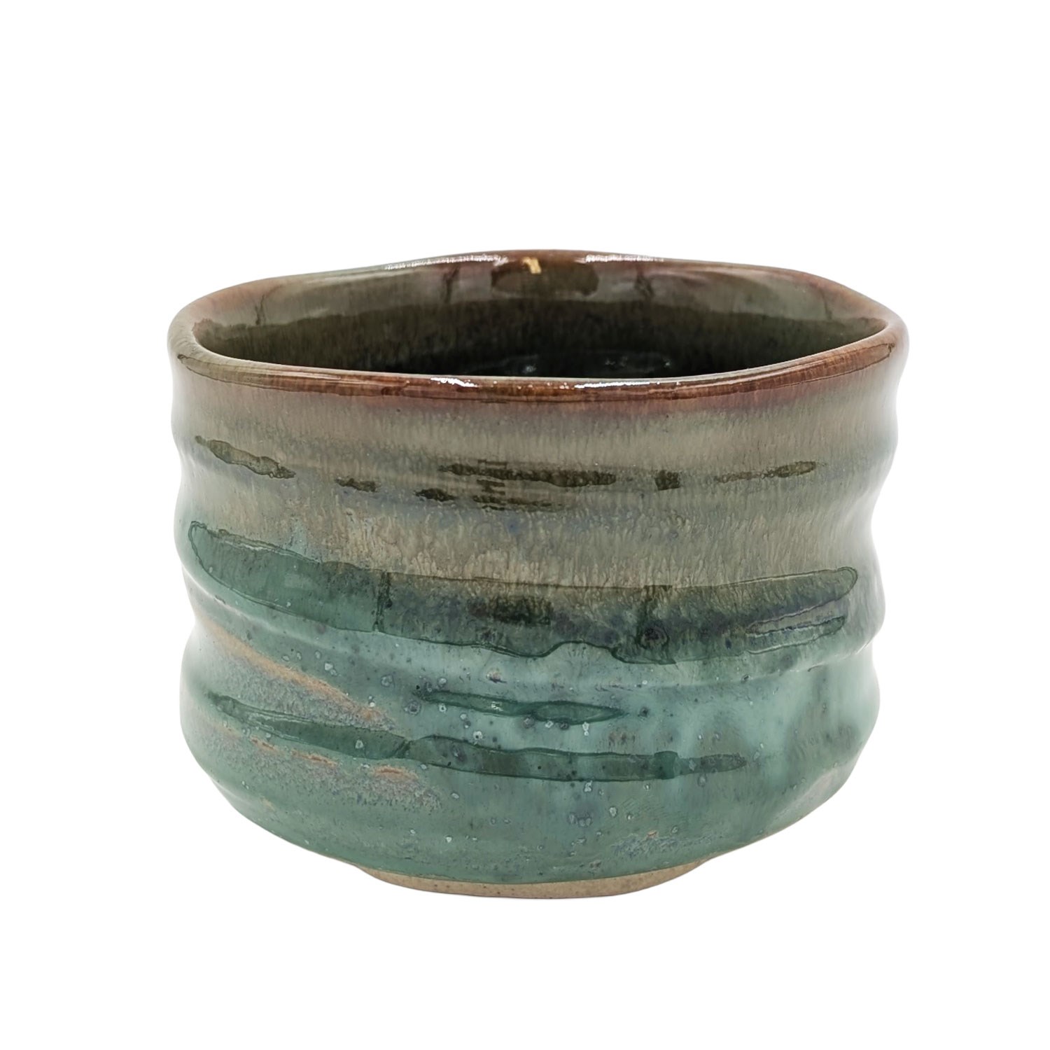 Handmade green-brown ceramic tea bowl